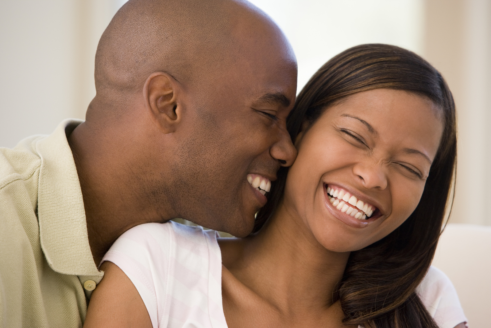 young black couple laughing and smiling with nice teeth, Cosmetic Dentistry...